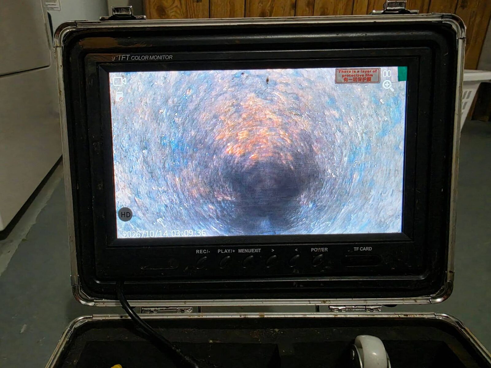 HD sewer camera monitor on-site in Omaha showing the inside of a drain line during a JetSet Solutions push-camera inspection
